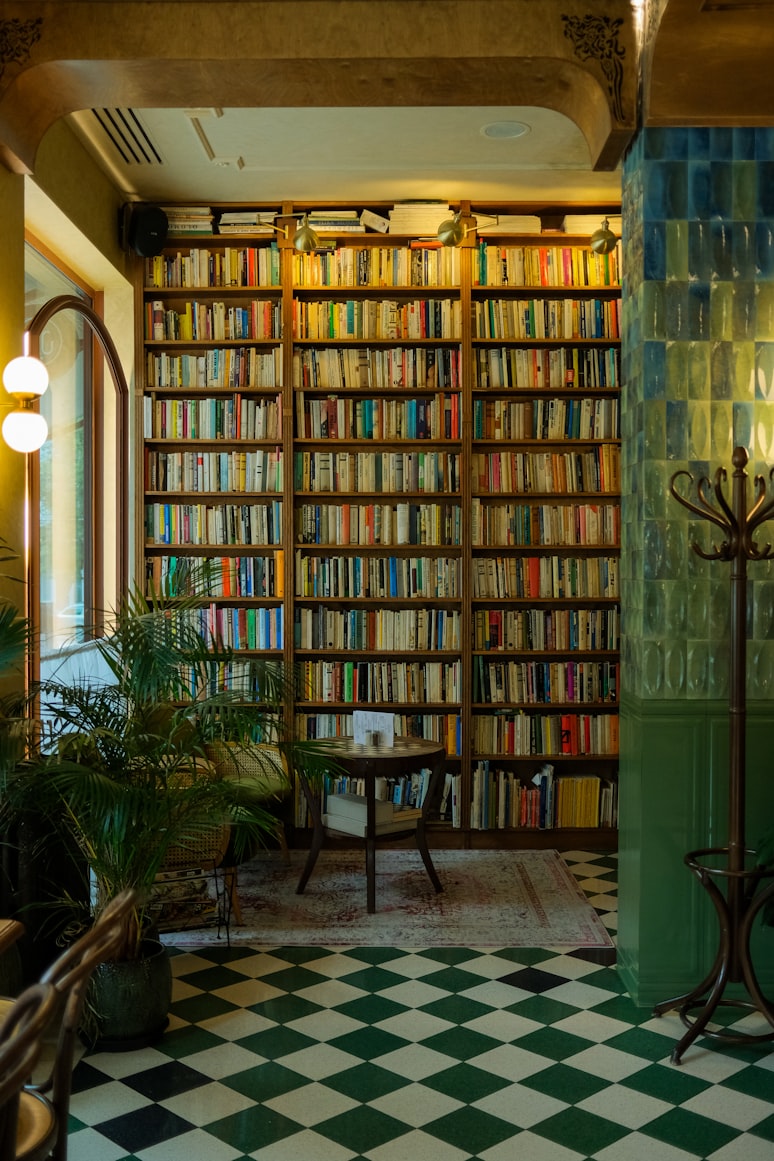 A warm reading nook with floor-to-ceiling bookshelves